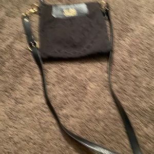 Coach black cross body purse in great condition purple inside lining